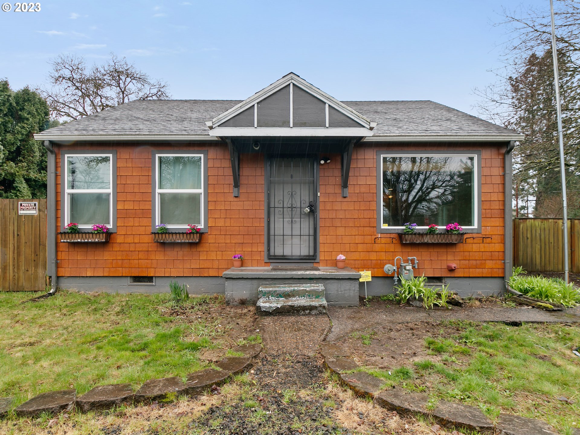 a front view of a house with garden