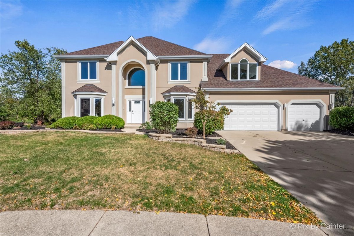 front view of a house with a yard