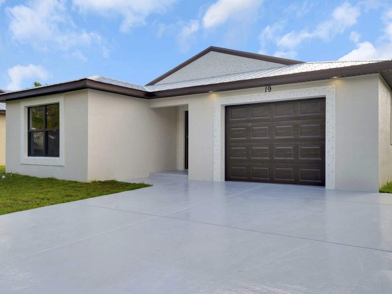 a house with yard and garage