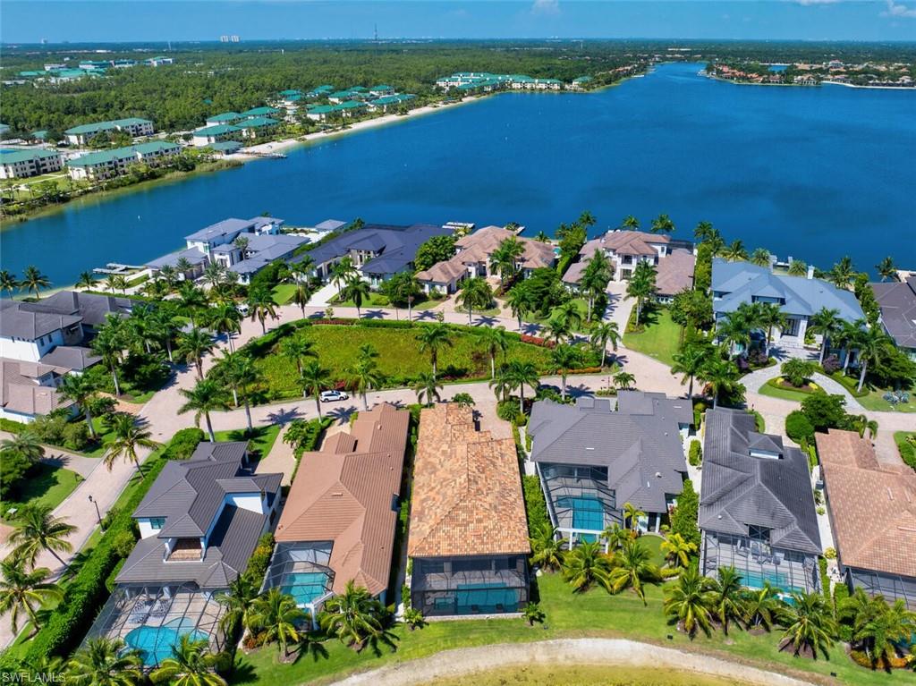 an aerial view of a house with a lake view