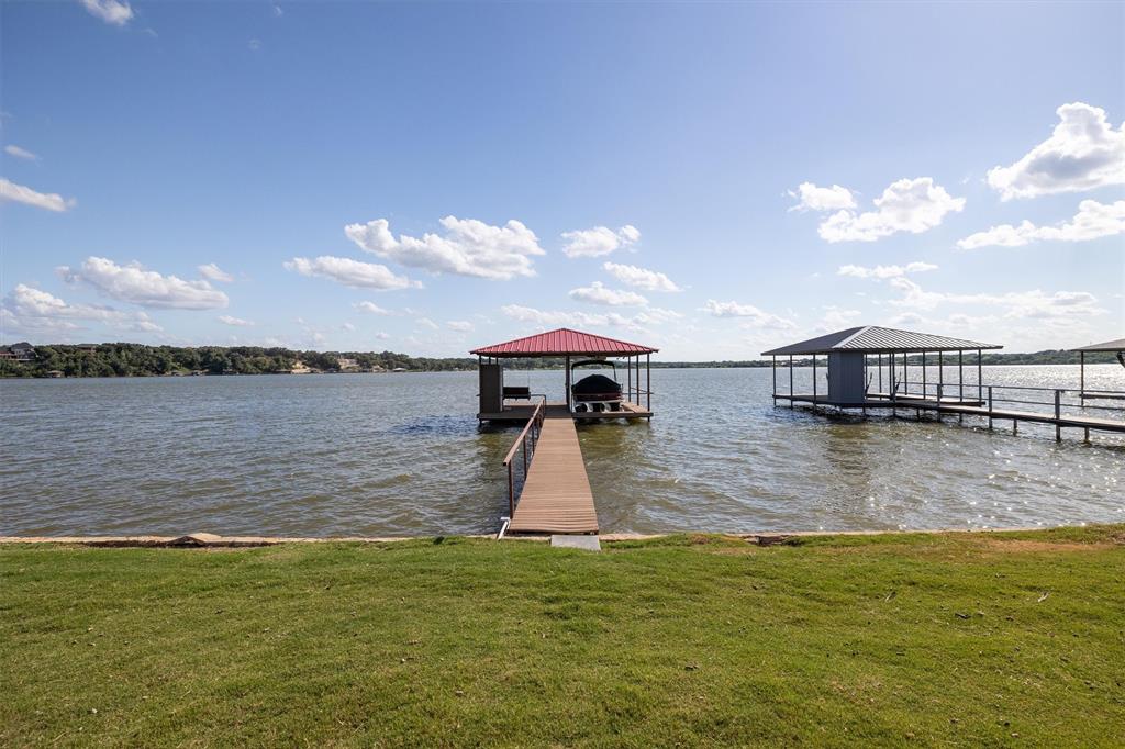 a view of a lake with a yard