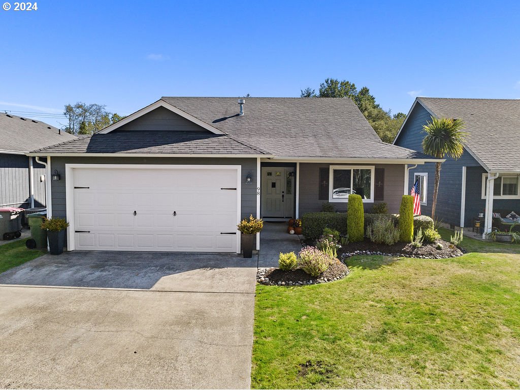 a front view of a house with garden