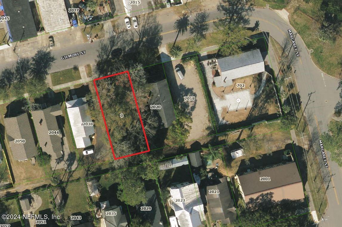 an aerial view of a residential houses with outdoor space