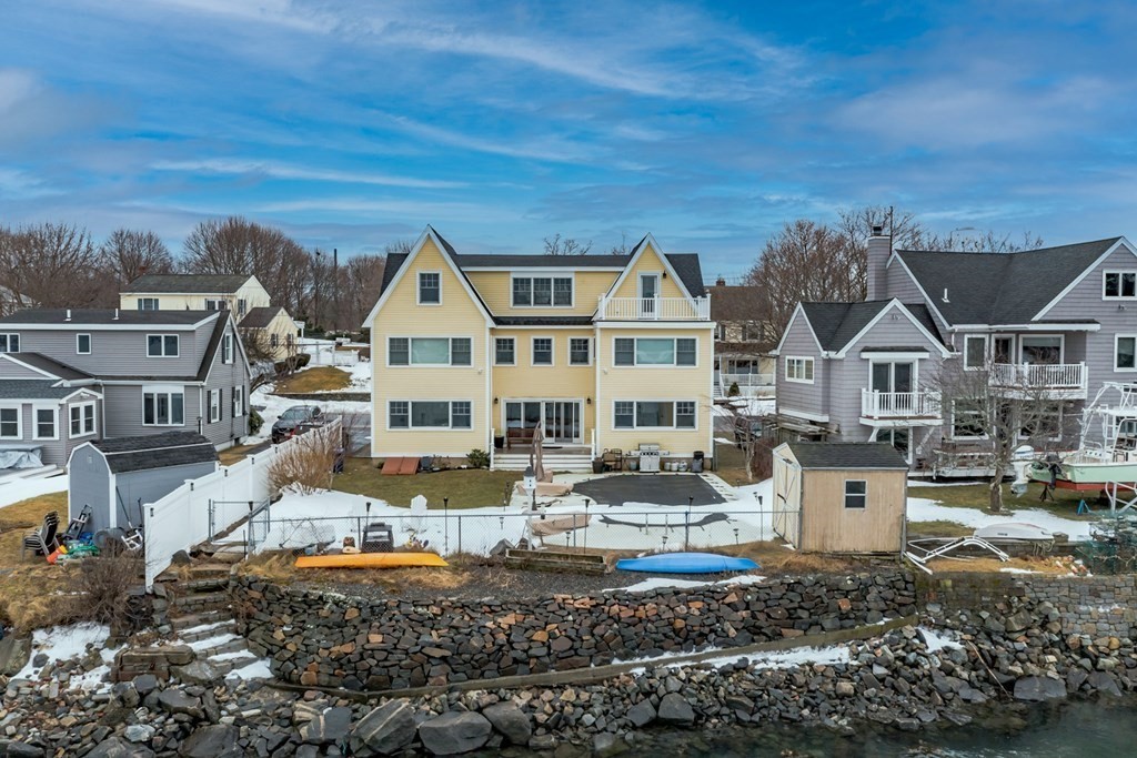 a front view of a house with a ocean view