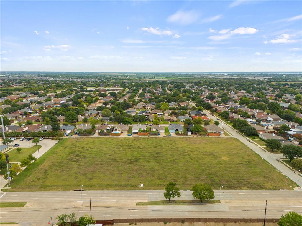 an aerial view of residential building and ocean