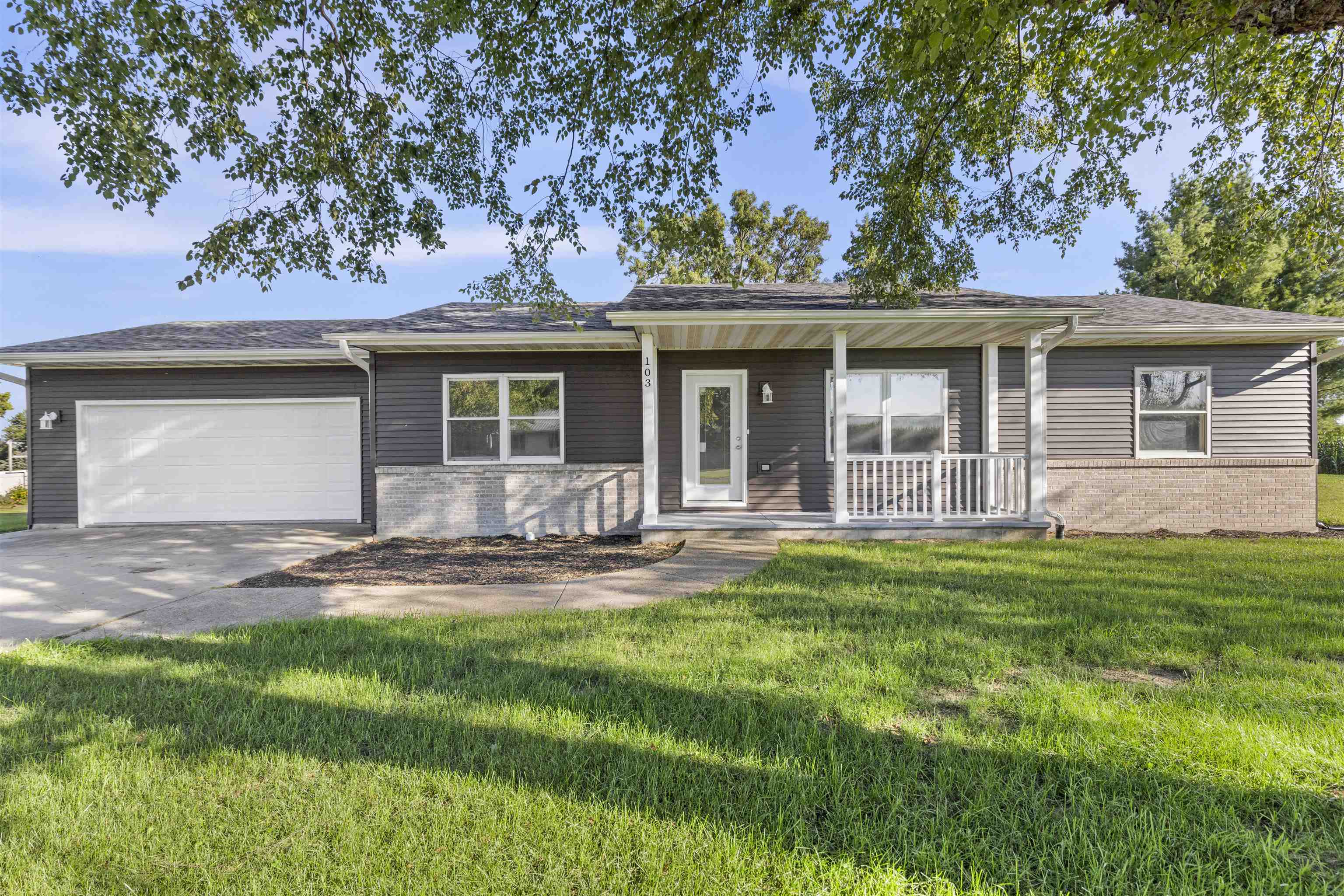 front view of a house with a yard