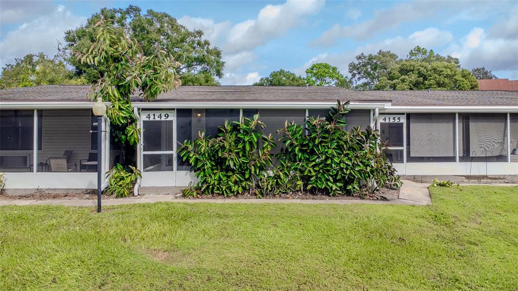 front view of a house with a yard