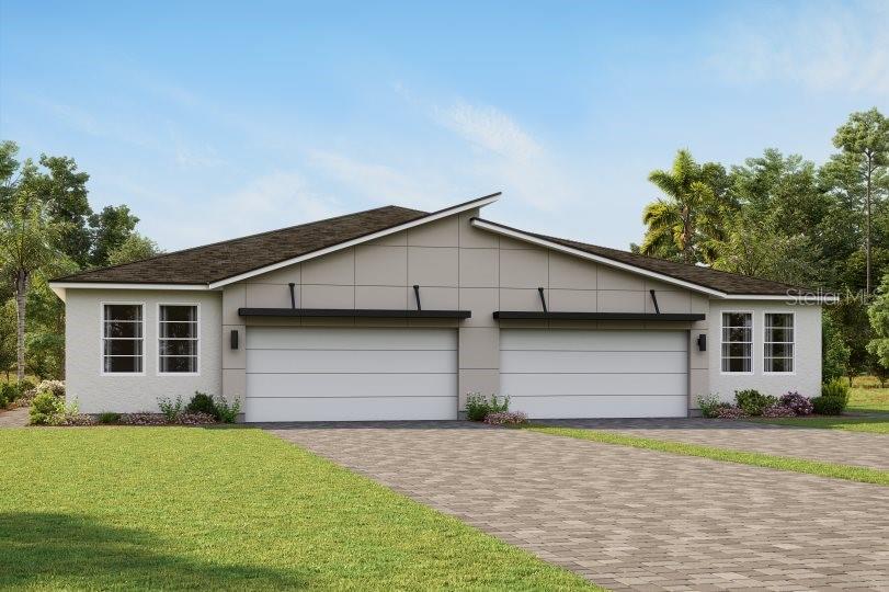 a front view of house with garage and yard