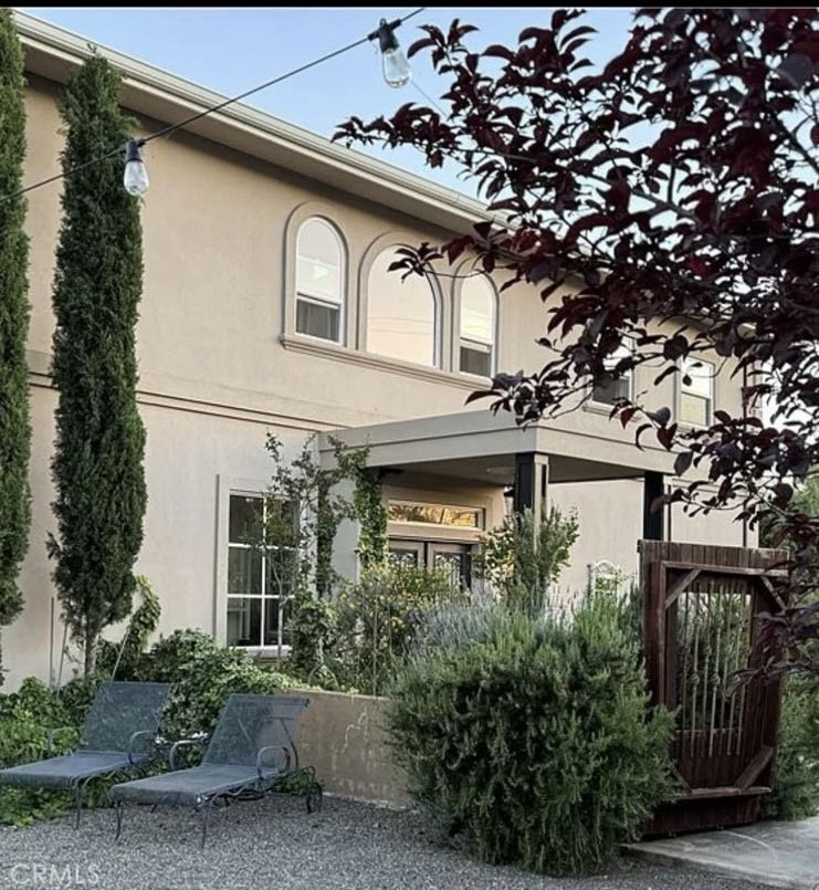 a front view of a house with garden