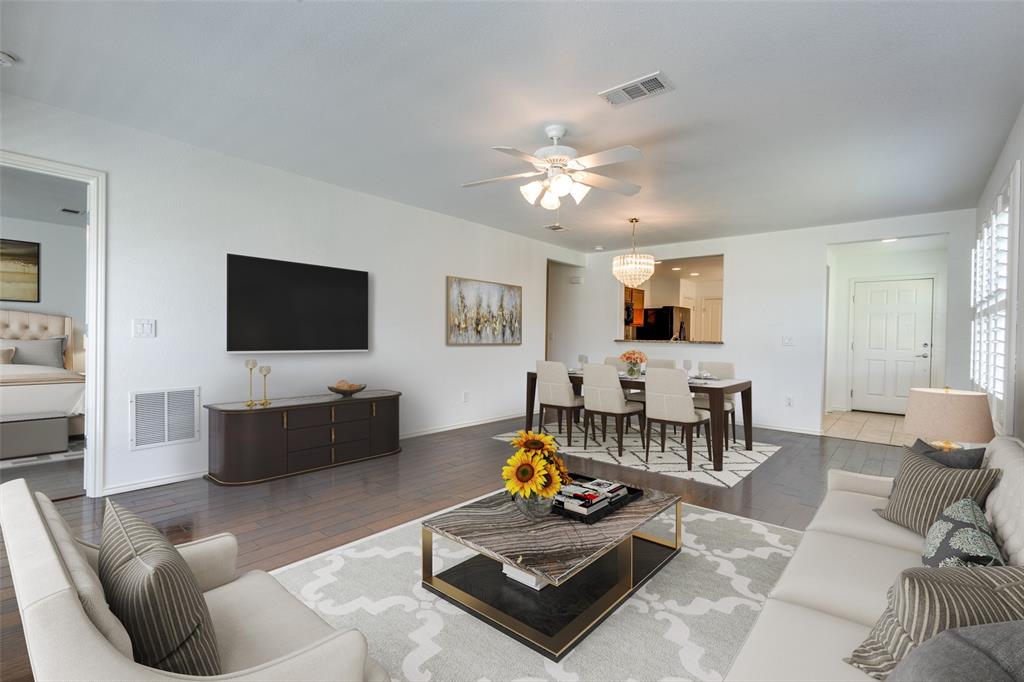 a living room with furniture and a flat screen tv