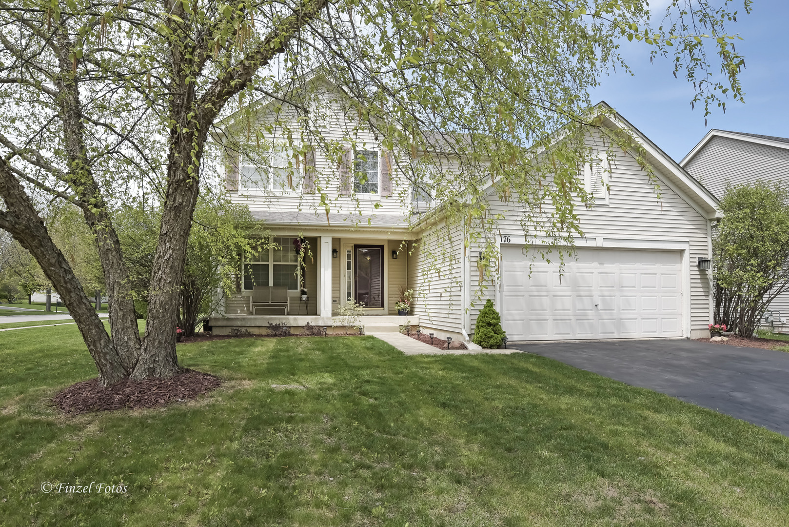 front view of a house with a yard