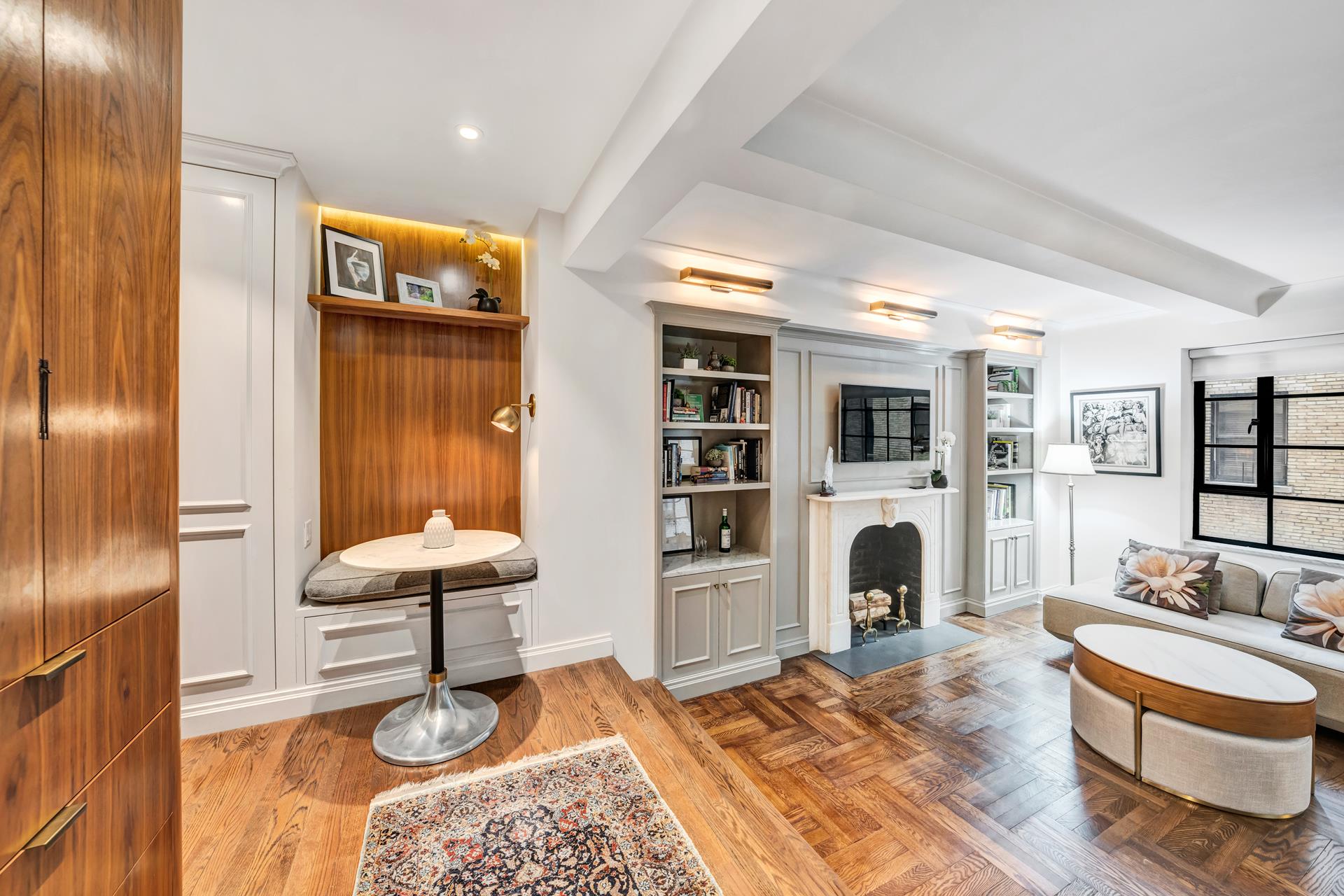 a living room with furniture and a fireplace