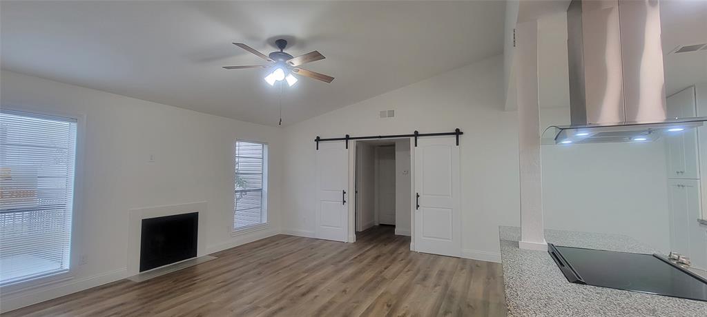 wooden floor in an empty room with a fireplace