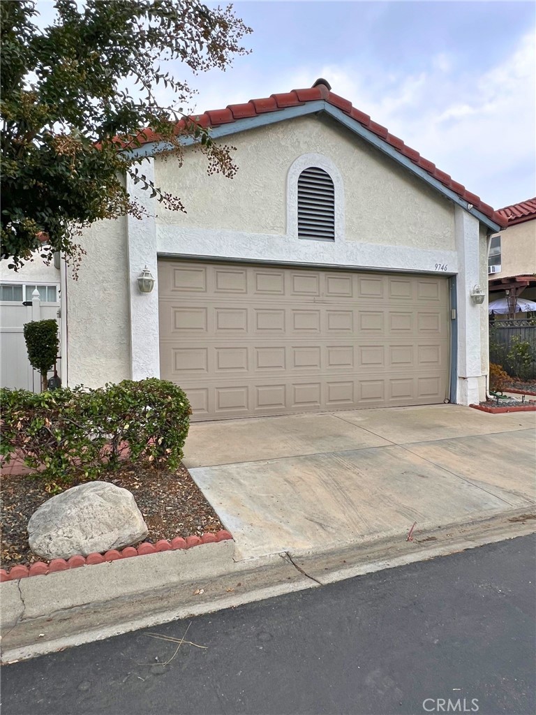 a front view of a house with a garage