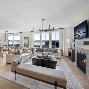 a living room with furniture fireplace and flat screen tv