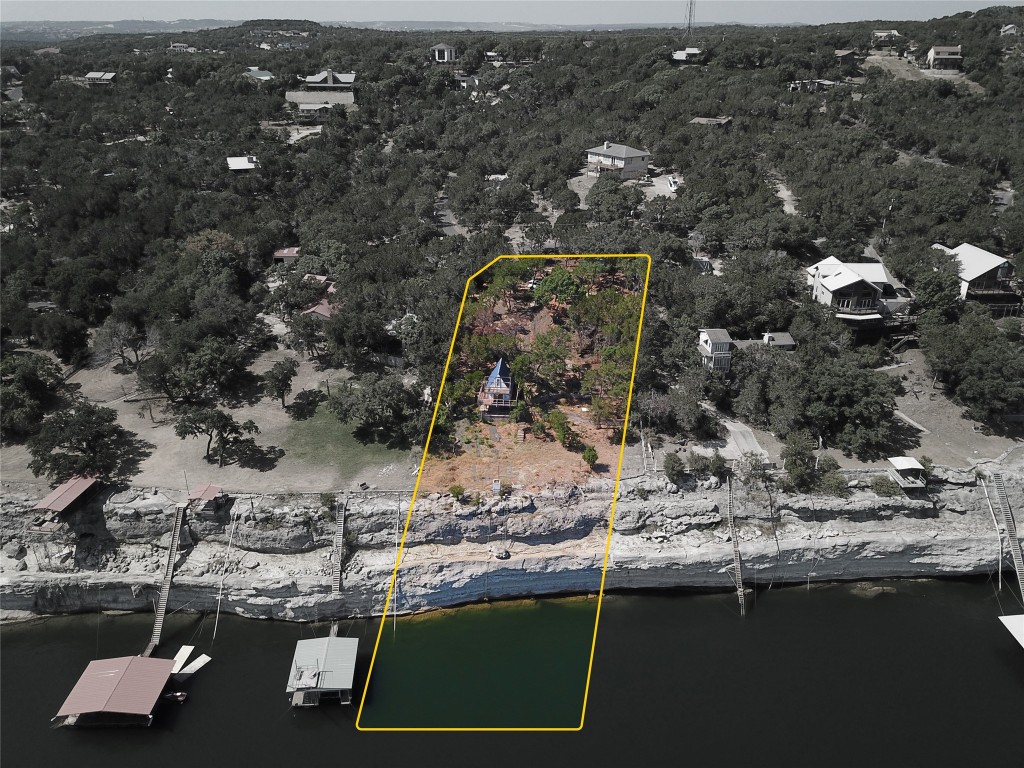 an aerial view of a house with a lake view