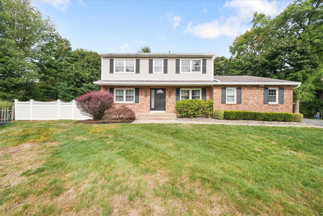 Welcome home to this stately Colonial nestled in a cul de sac