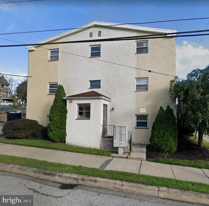 a view of a house with a street