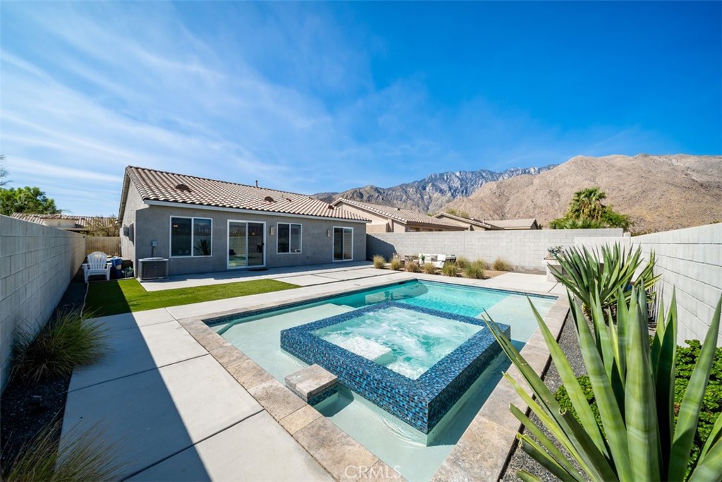 a view of a swimming pool with an outdoor seating