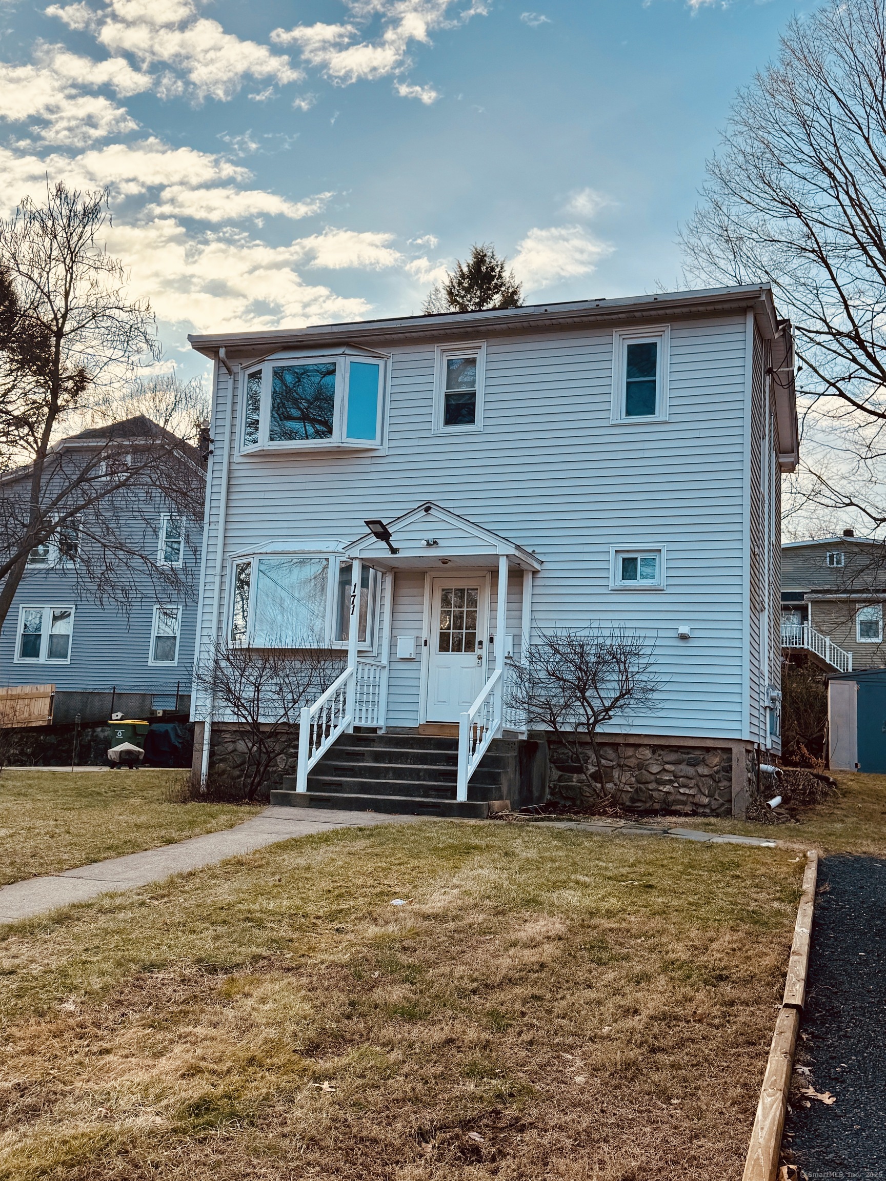 a front view of a house with a yard