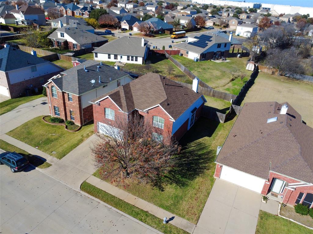 an aerial view of a house with a garden