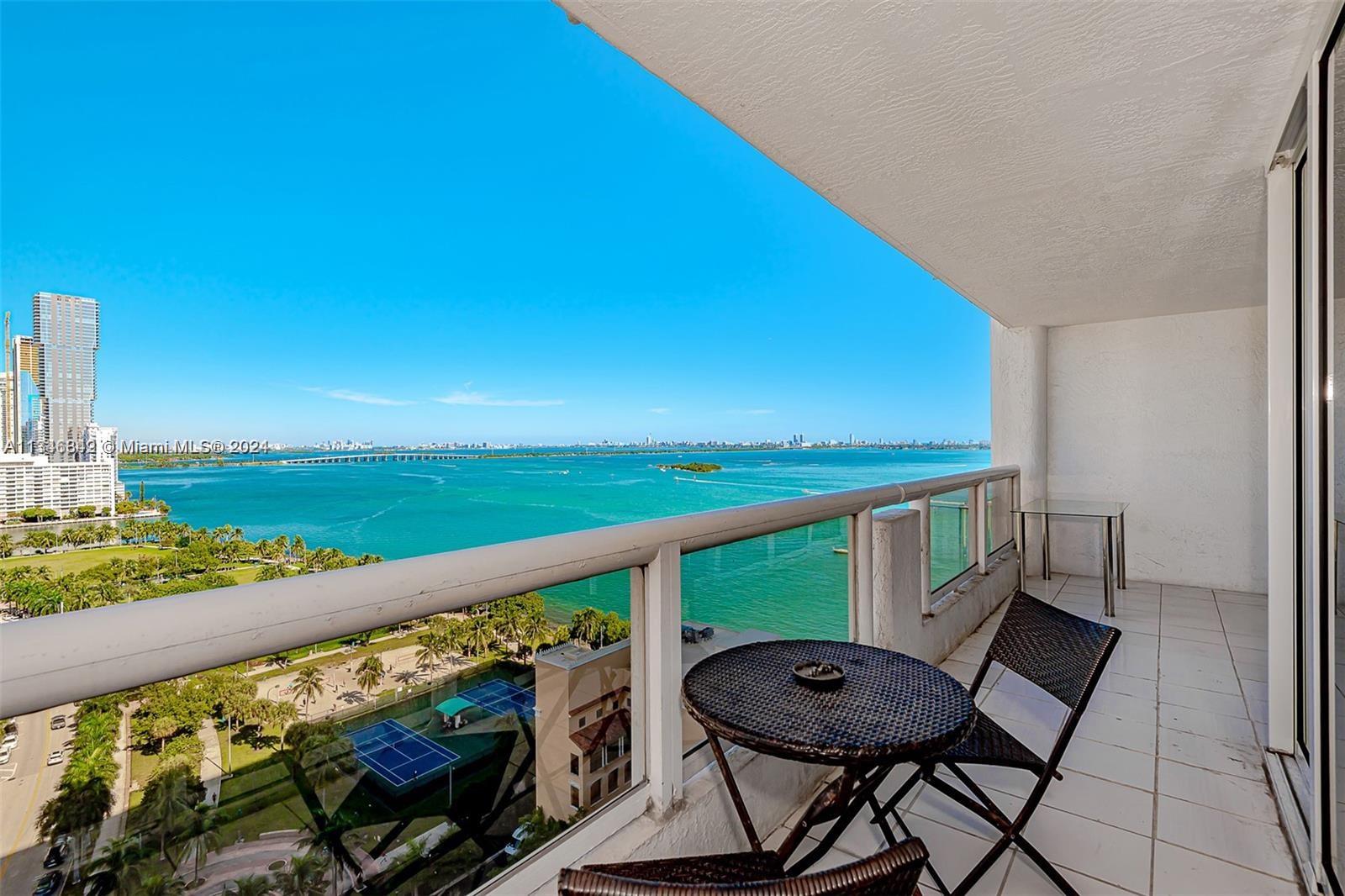 a view of a balcony with chairs