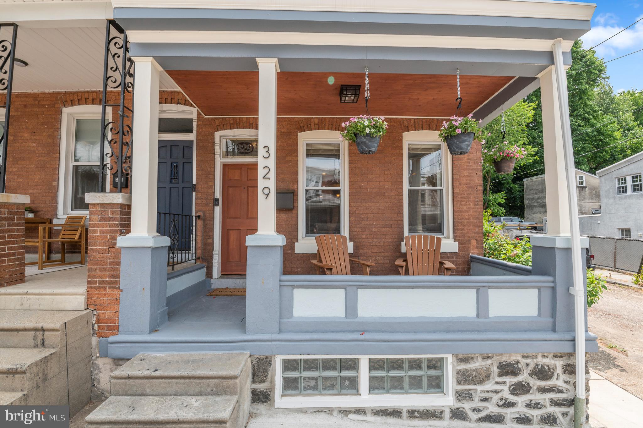 a view of a building with a potted plant and a porch