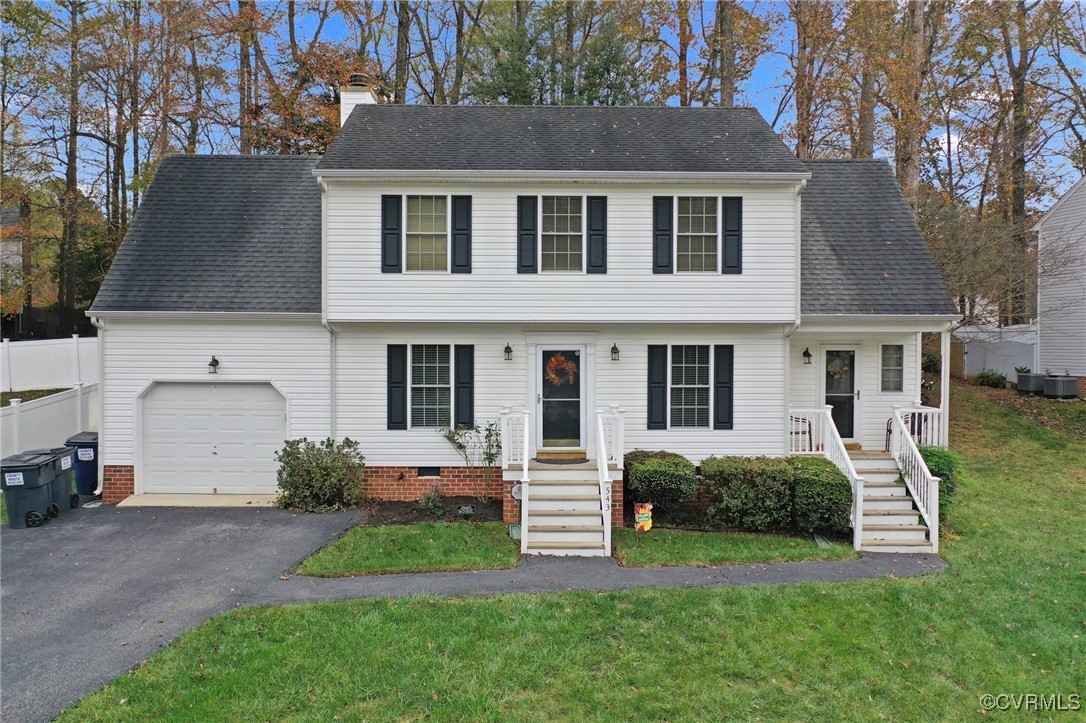 View of front of property with a front yard and a