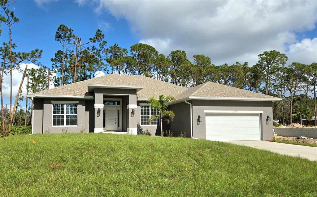 front view of a house with a yard