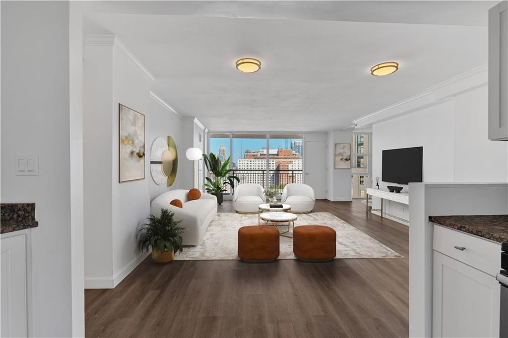 a living room with furniture and a flat screen tv