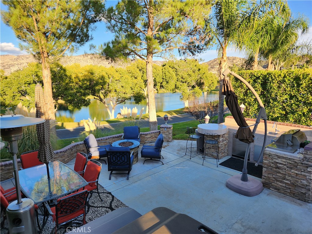 a view of a patio with swimming pool table and chairs