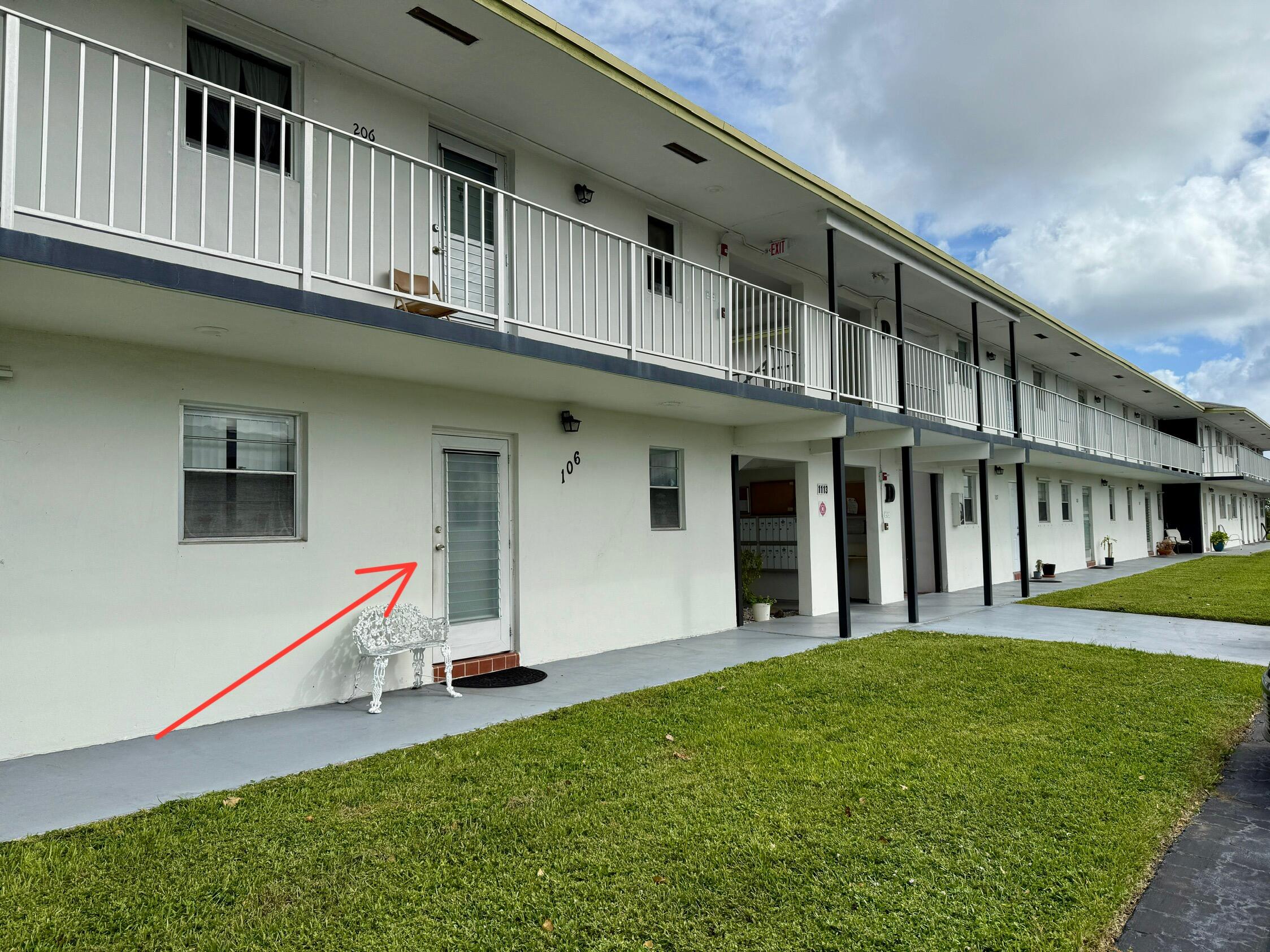 a view of a house with backyard and deck