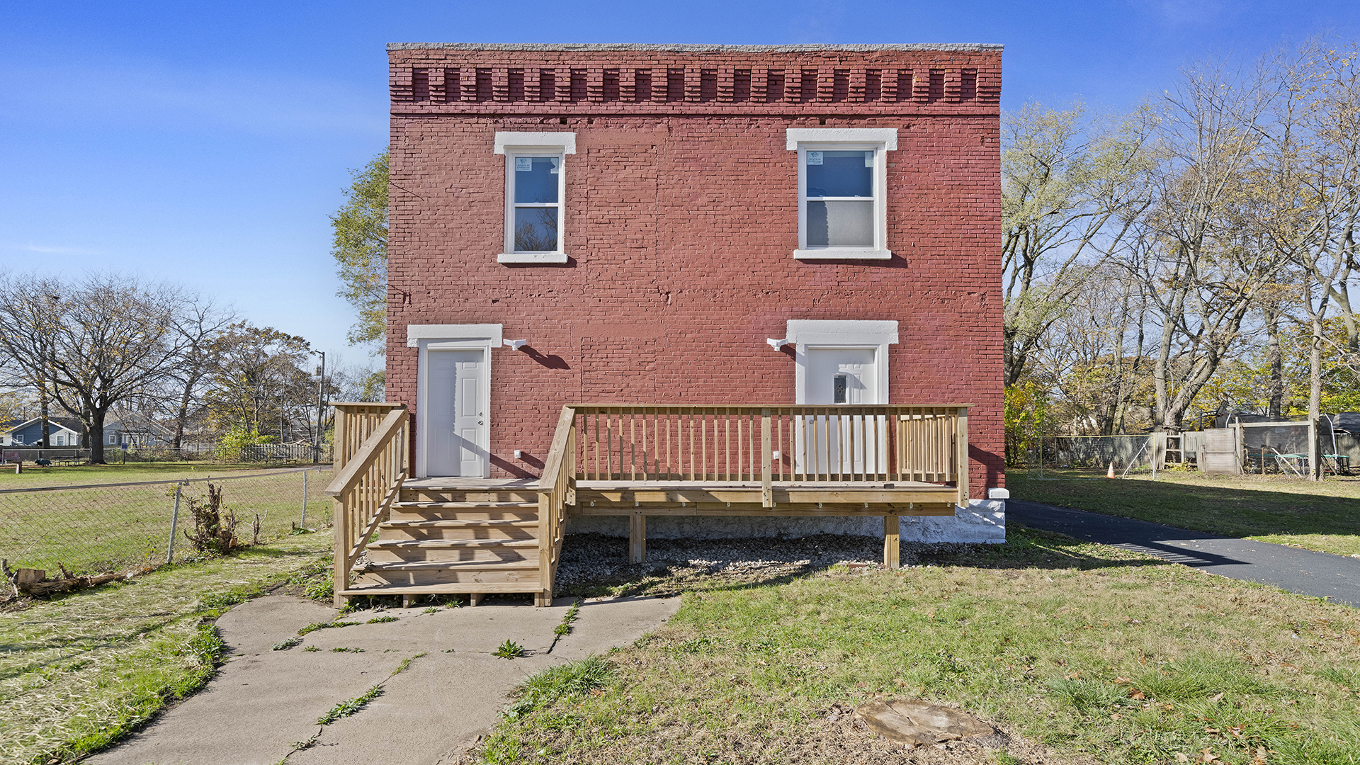 front view of a house with a yard