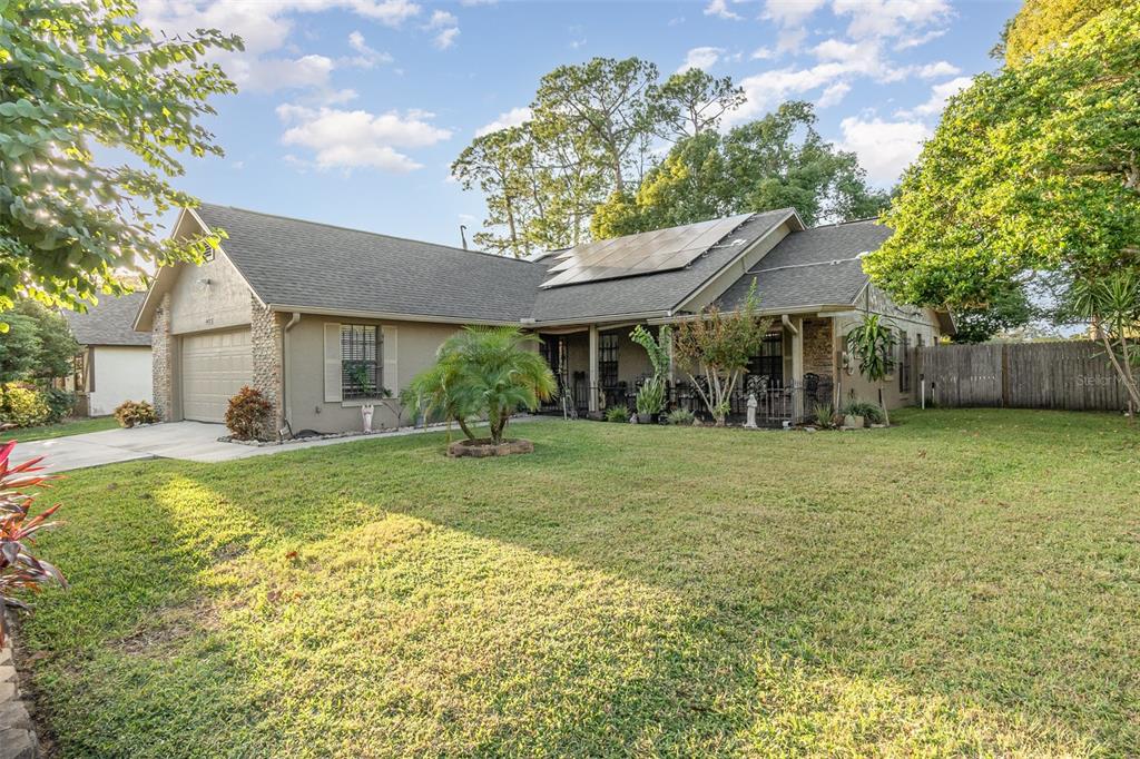 a view of a house with a yard