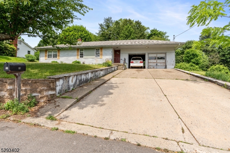 a front view of a house with garage