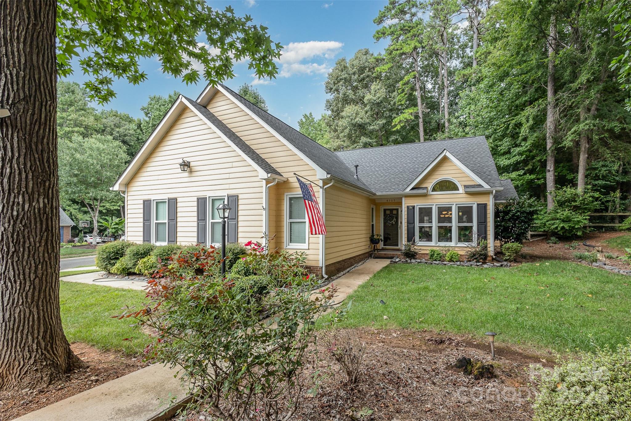 front view of a house with a yard