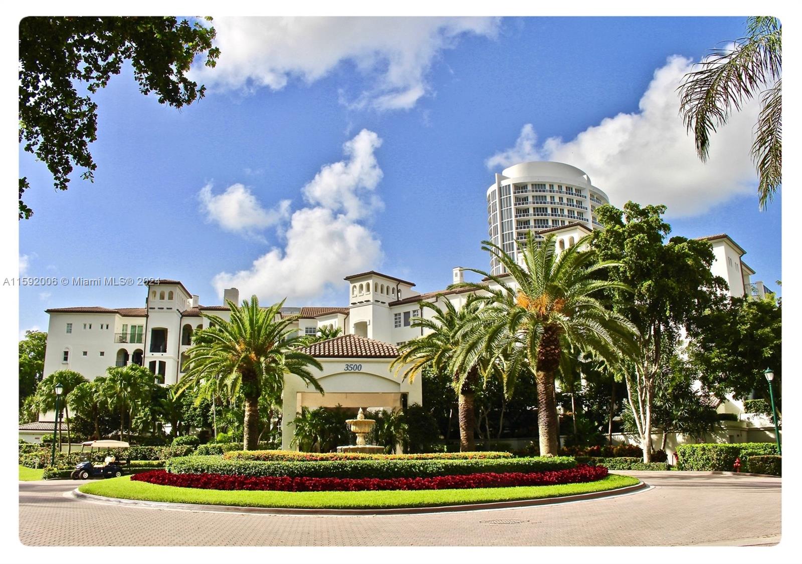 a view of multi story residential apartment building with a yard