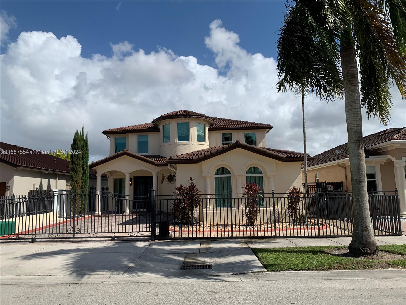 front view of a house with a garden