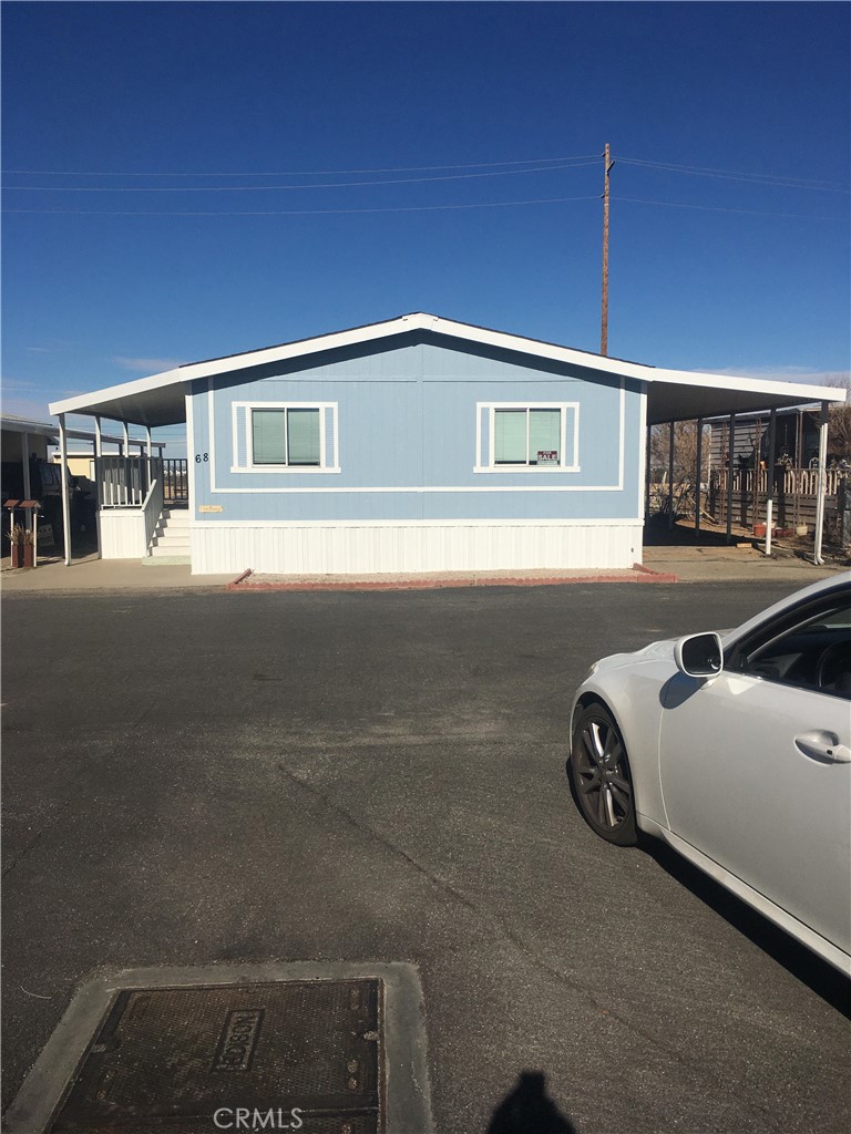 a front view of a house with parking space