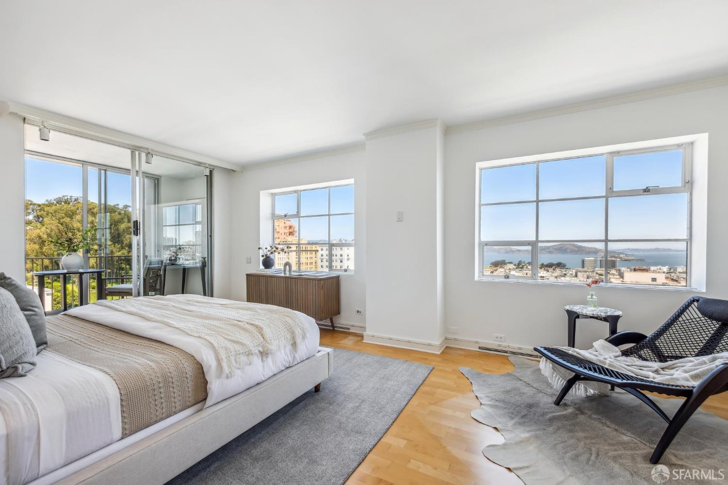 a bedroom with a bed window and desk