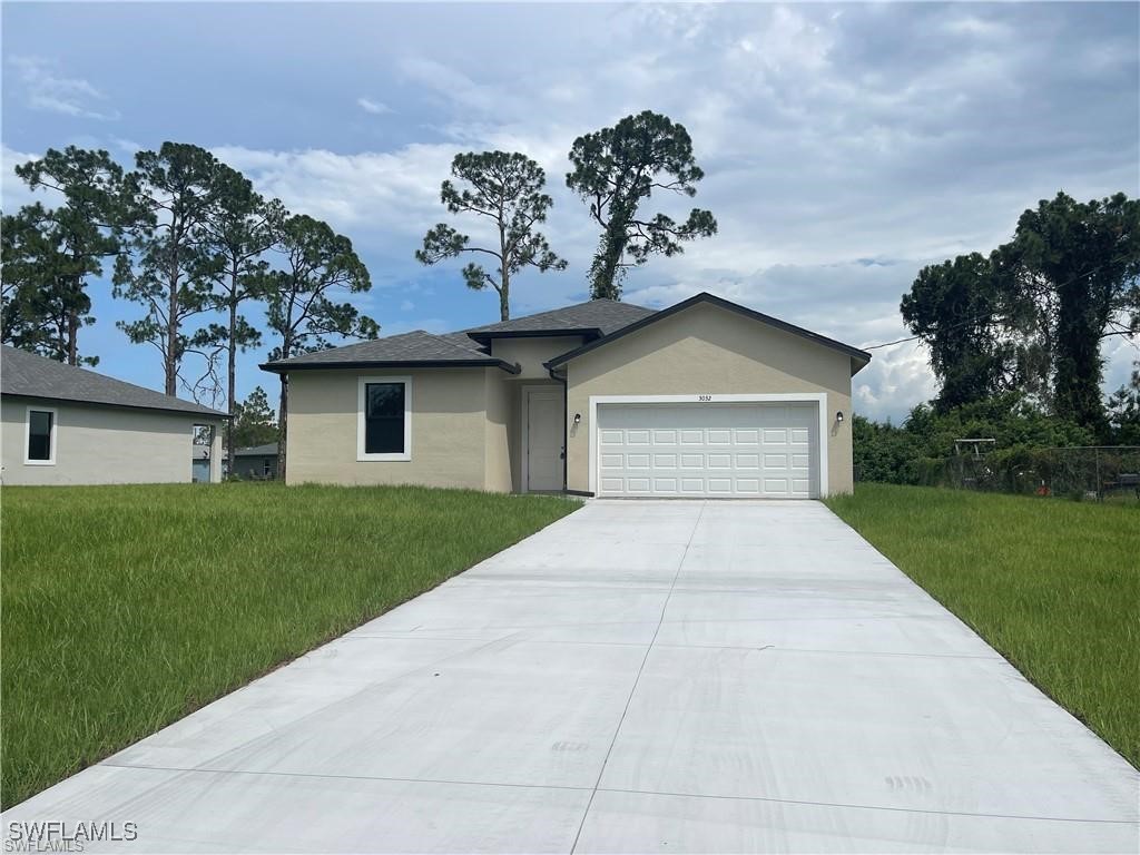 a view of a house with a yard