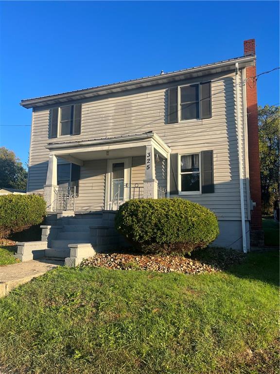 front view of a house with a yard