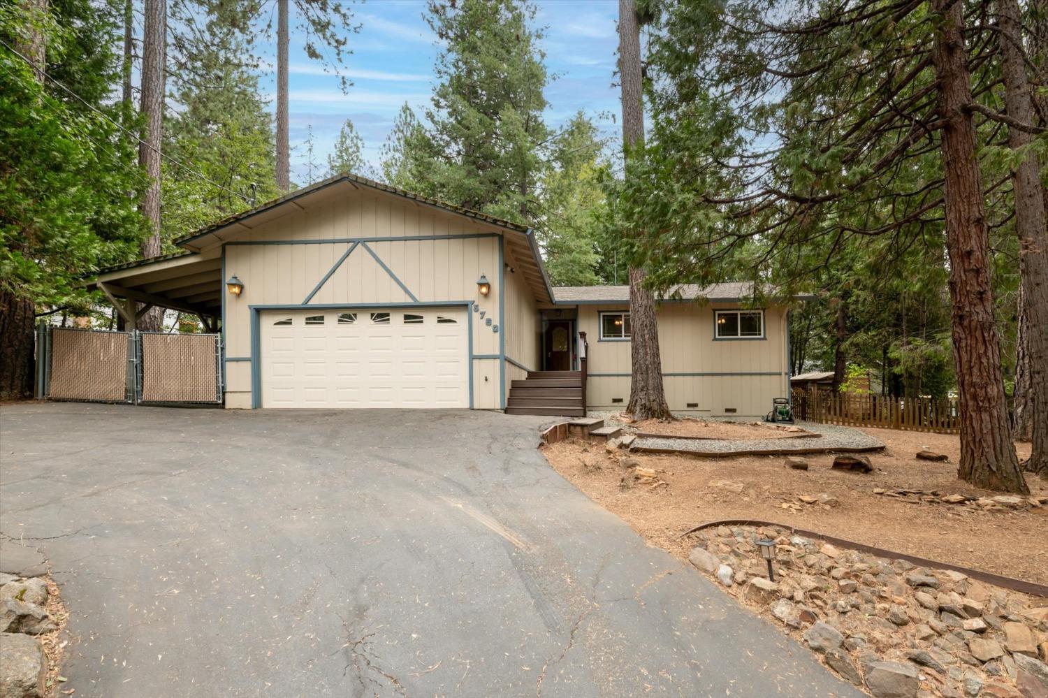 a view of a house with a wooden fence