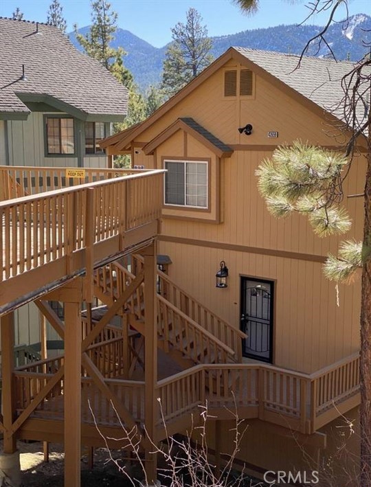 a view of a house with wooden fence