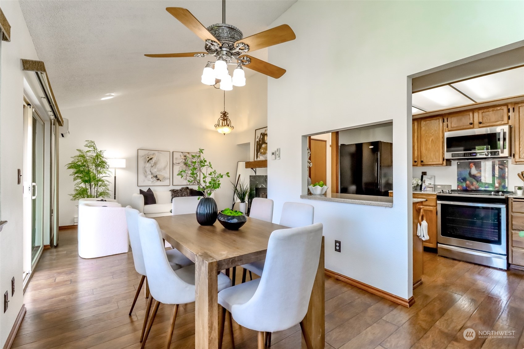 a view of a dining room with furniture window and wooden floor