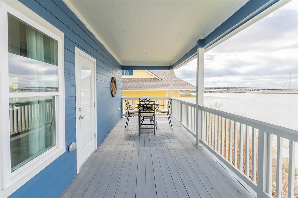 a view of a balcony with wooden floor