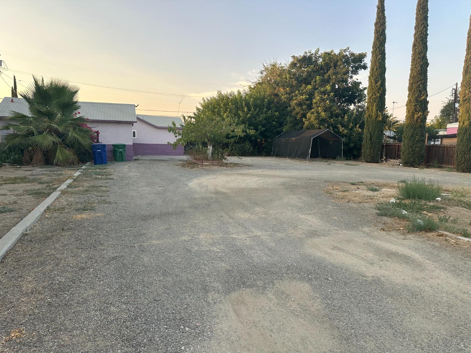 a view of a house with a yard and garage