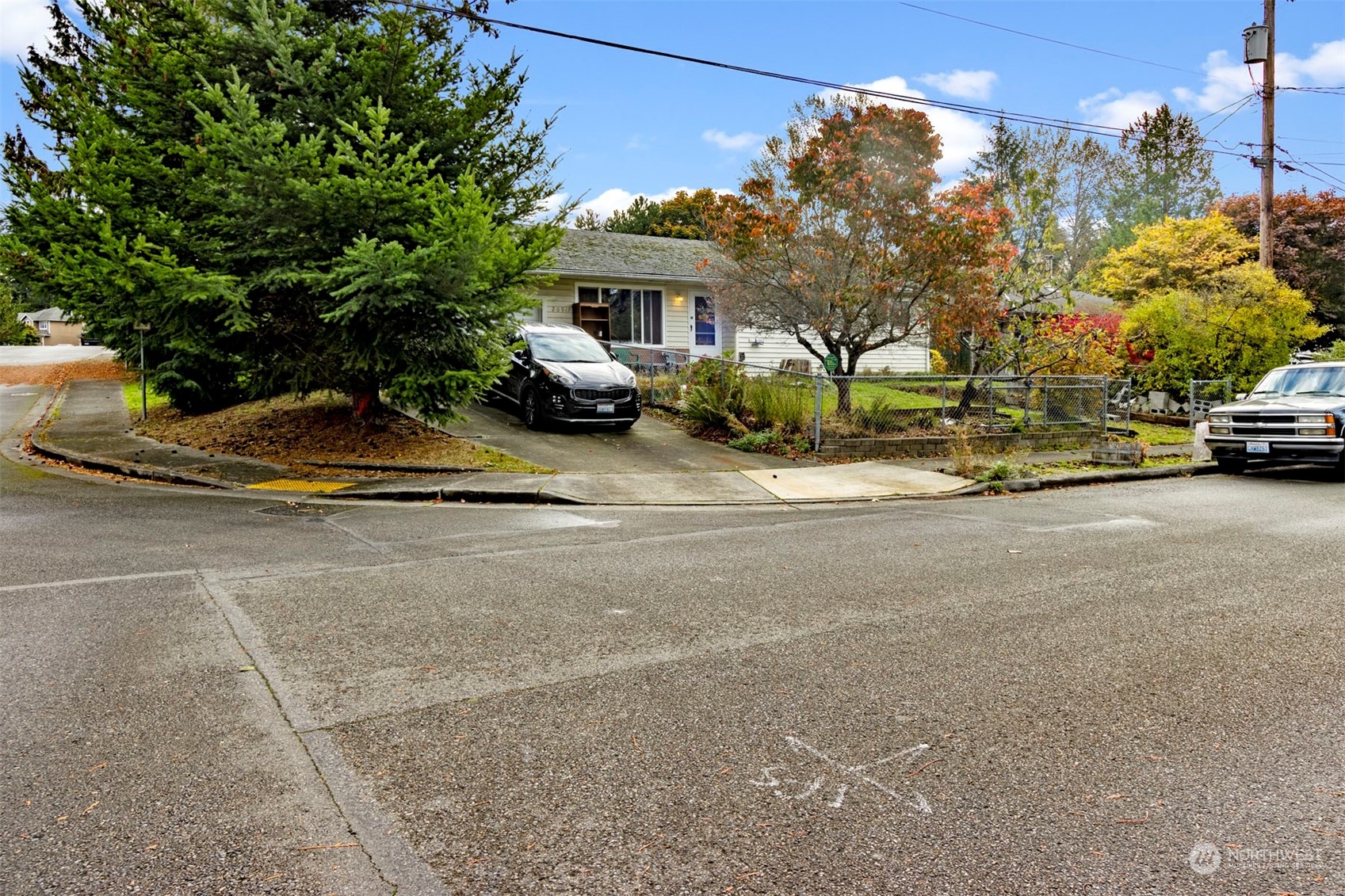 a view of street with parked cars