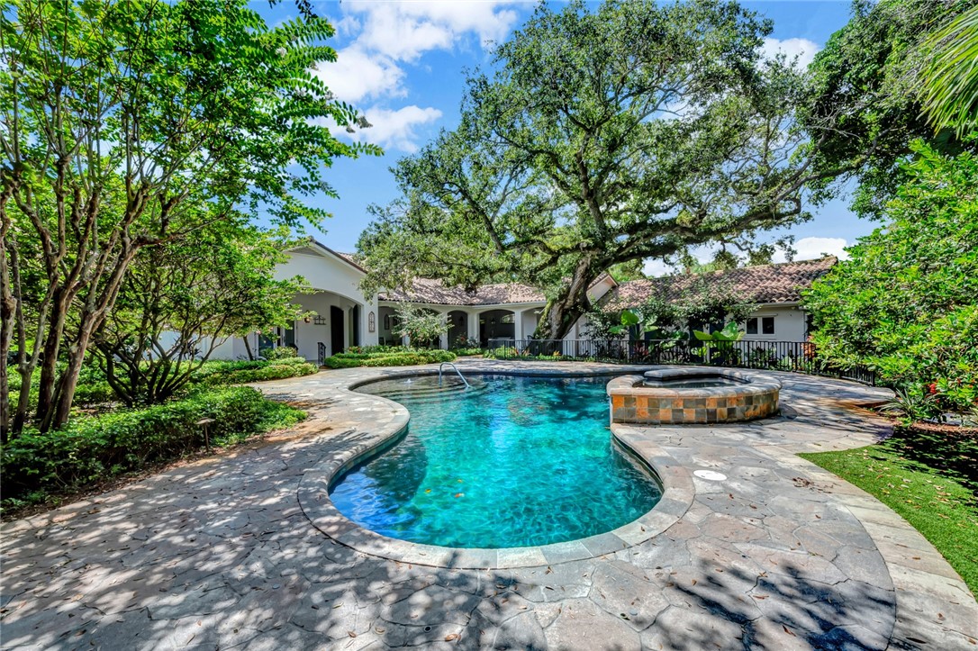 a view of a swimming pool with a patio