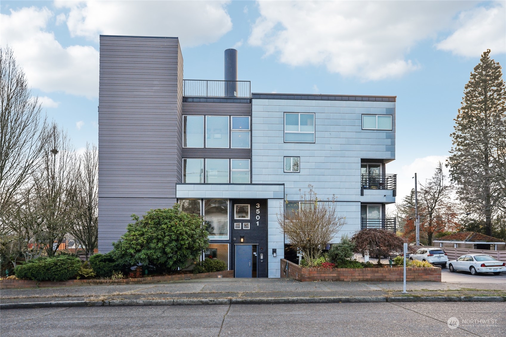 a front view of a building with street view